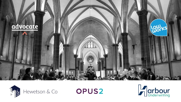 The conductor leads the Temple Church choir in song The conductor leads the Temple Church choir in song